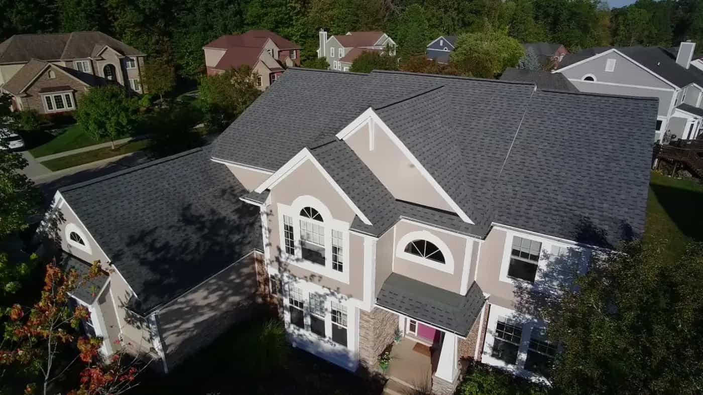 Drone view of a finished Roofing Army roof replacement in a Michigan neighborhood