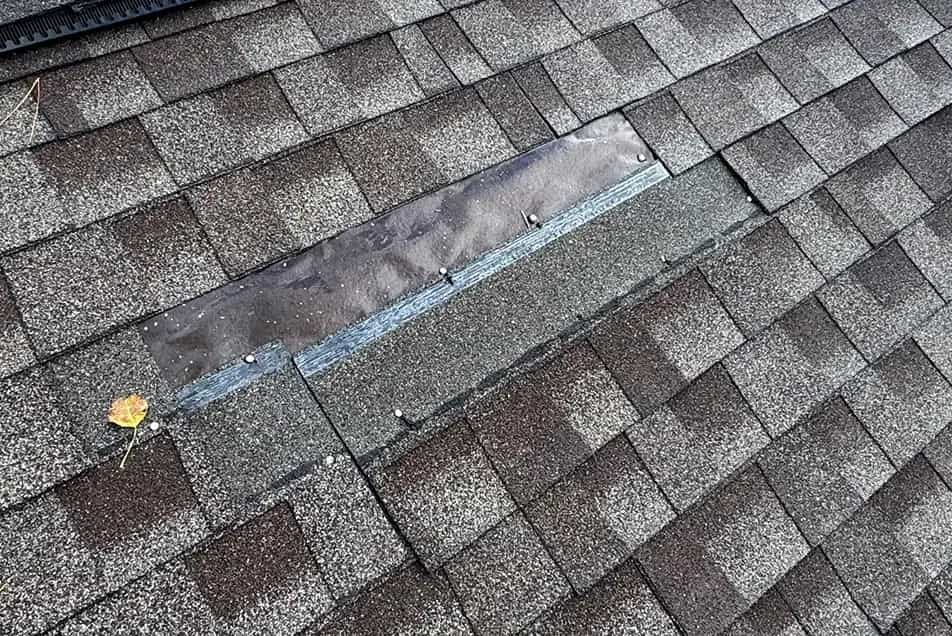 Missing or Lifted Shingles - SE Michigan Storm Damage Roofing wind damaged shingles blown off on a roof
