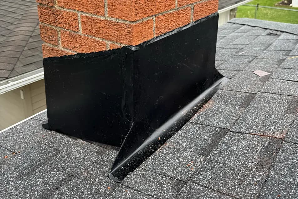 hand crafted chimney flashing on a brick chimney