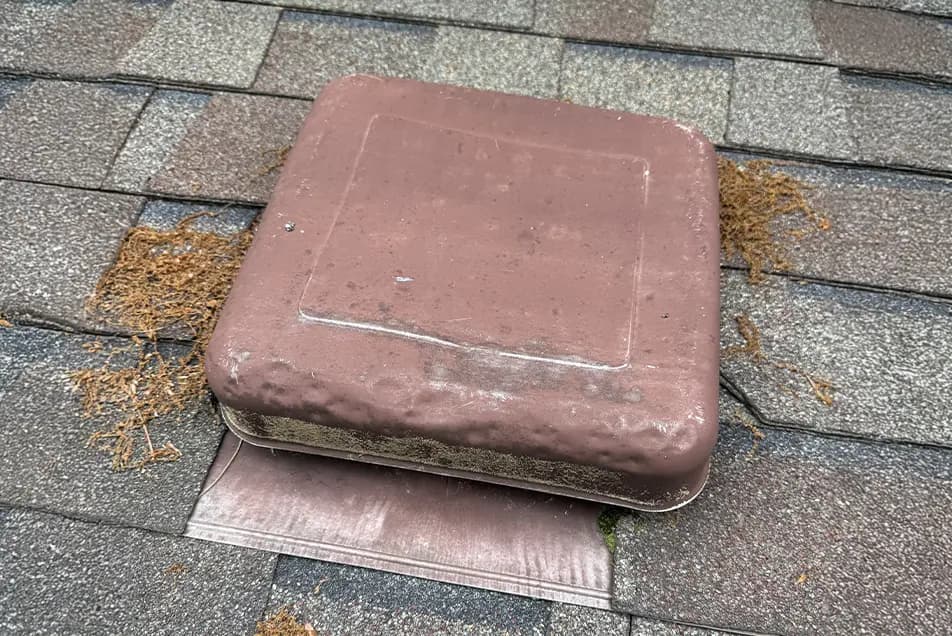 box vent with hail impact dents on it