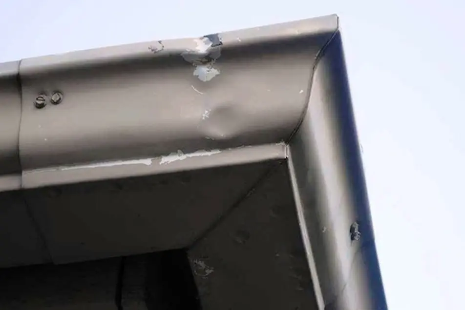 Dented Gutters - SE Michigan Storm Damage Roofing gutters with hail damage dents