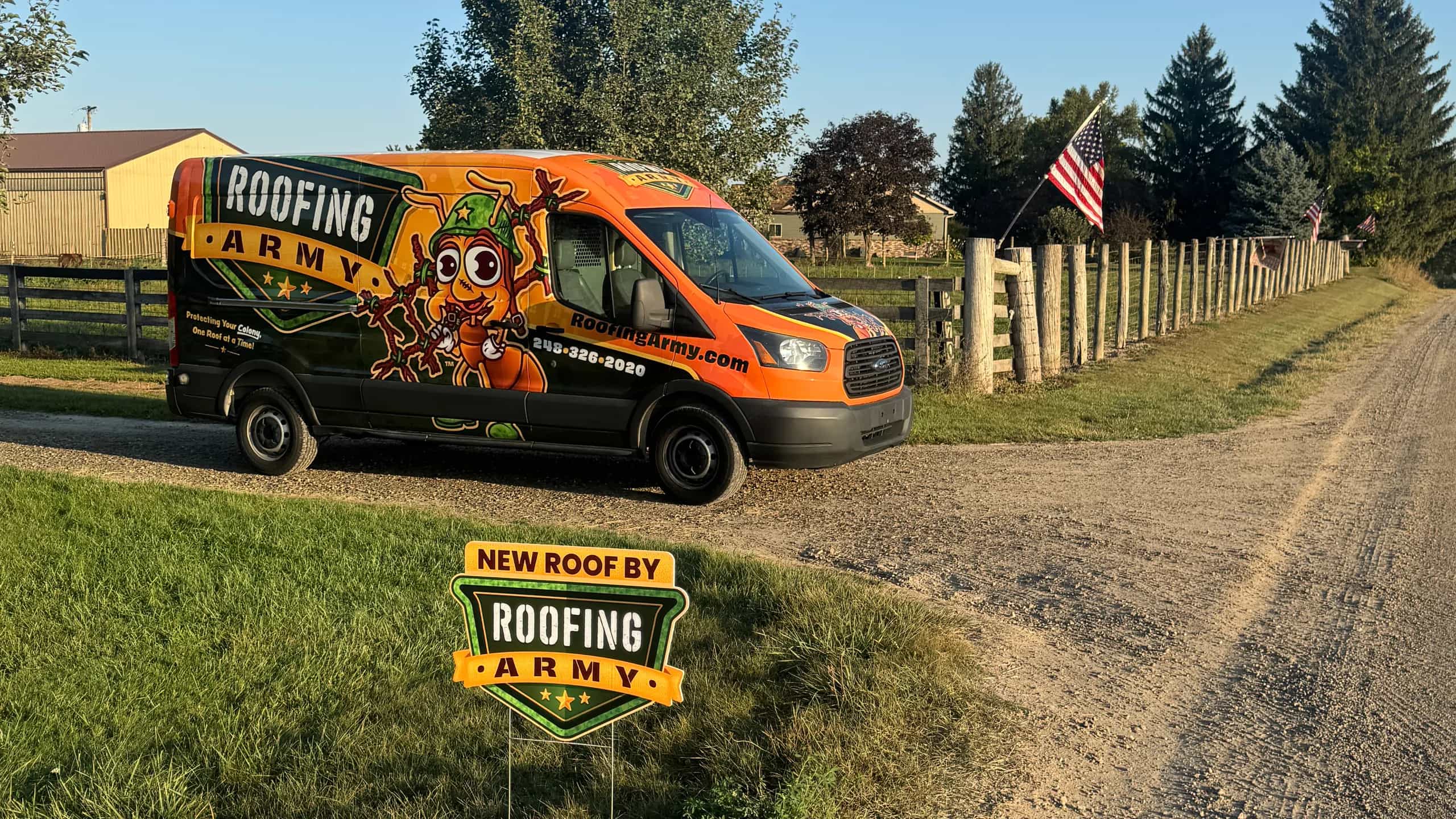 A Roofing Army van and yard sign outside a completed roof replacement in Michigan