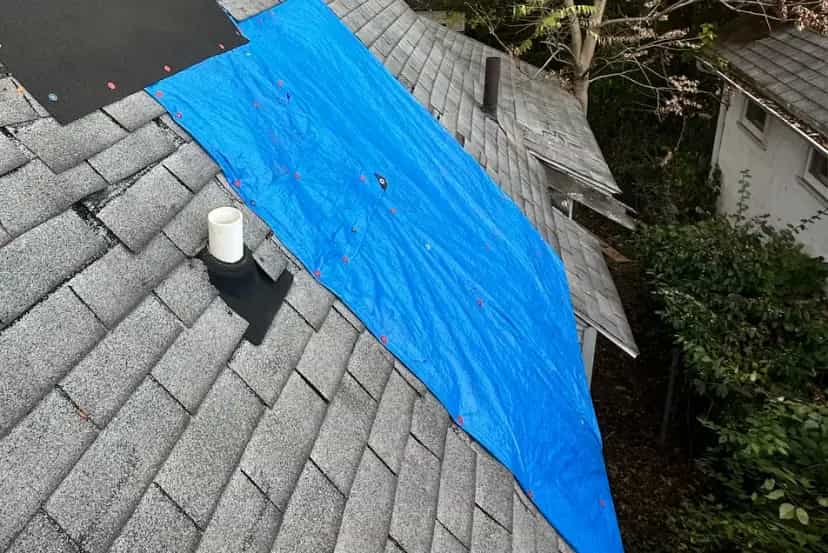 Emergency Tarping Services in Southeast Michigan - Roofing Army asphalt shingle roof in michigan with emergency tarping to cover damage