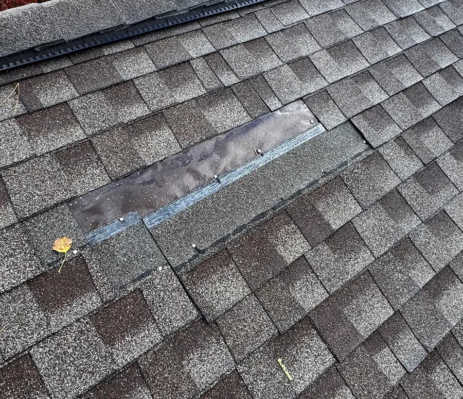 missing asphalt shingle on a michigan roof