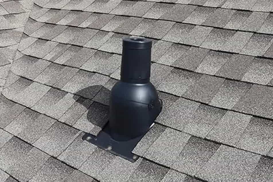 black pipe boot cover on an asphalt roof