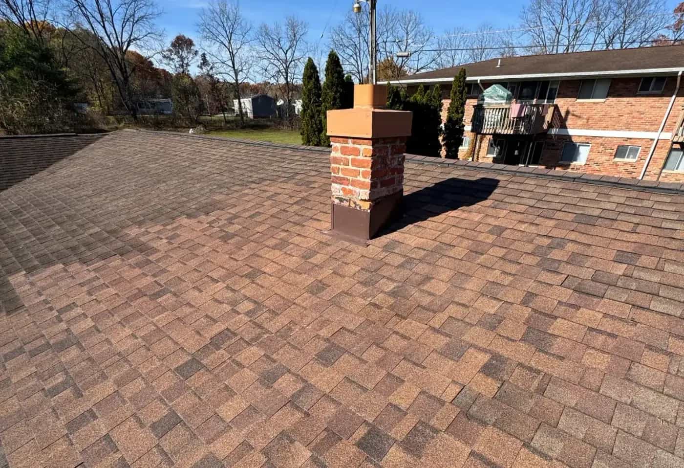 Roof repair work being done on a Michigan home Roof repair work being done on a Michigan home