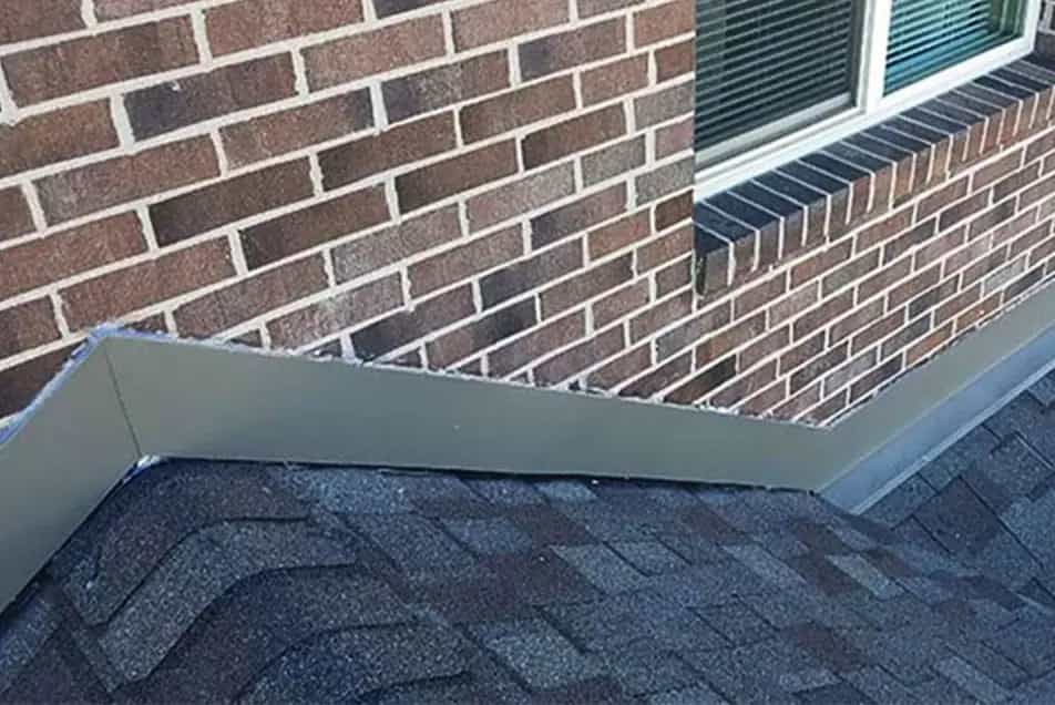 Wall Flashing - Roof Replacement in SE Michigan roof to wall counter flashing on a brick wall