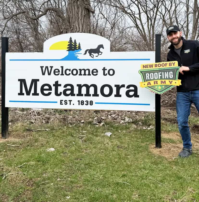 Aaron Scott, owner of Roofing Army, standing in front of the Metamora welcome sign in Metamora, Michigan Aaron Scott, owner of Roofing Army, standing in front of the Metamora welcome sign in Metamora, Michigan