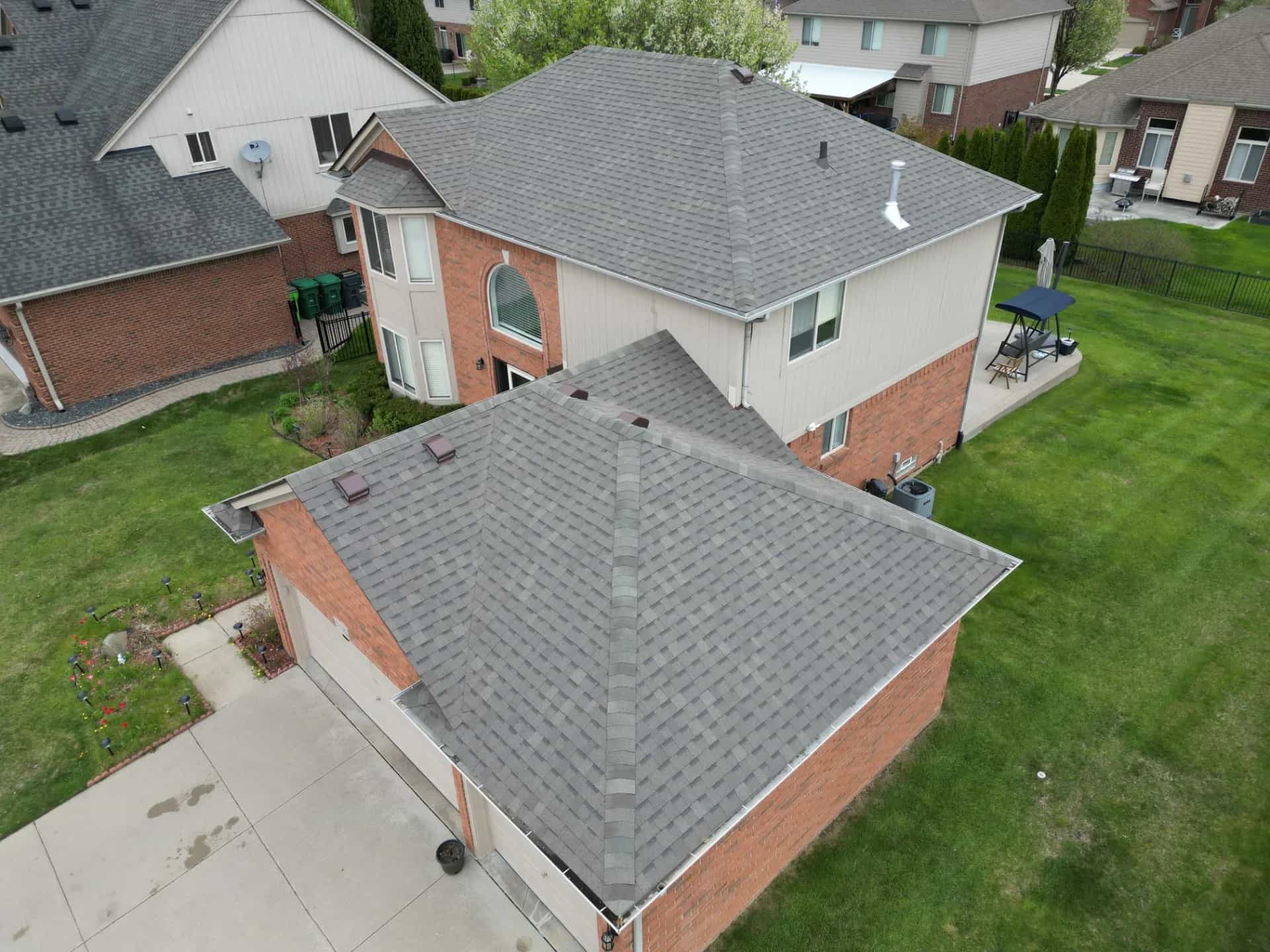Roof Replacement at 51782 Flyer Drive, Macomb by Roofing Army Roof Replacement in Macomb with Atlas Pinnacle Pristine Weathered Wood shingles — completed by Roofing Army