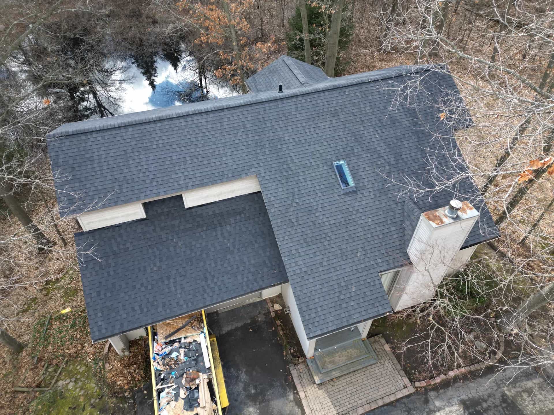 Roof Replacement at 495 Knollwood Dr, Lake Orion by Roofing Army Roof Replacement in Lake Orion with CertainTeed Landmark Moire Black shingles — completed by Roofing Army